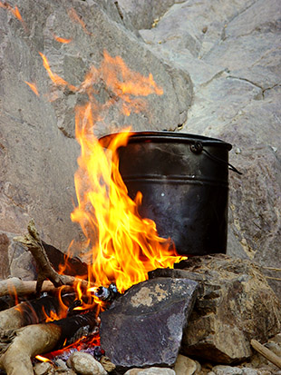 Cooking on an open fire  to a large gallery picture