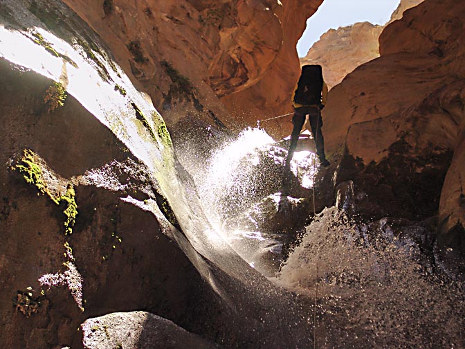 Yonathan rappels (abseils) a waterfall in Wadi el Karak, 2007