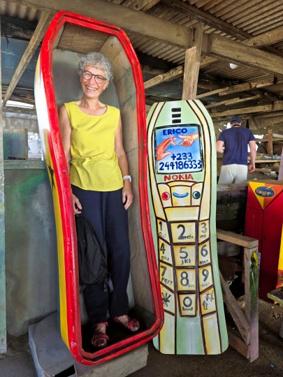 Katy inside a cellphone-shaped coffin made by Erico at Accra, Ghana 2025