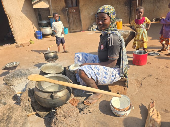 Food preparation at the center of a Dagomba living compound in Nbanayli Village, Ghana 2026