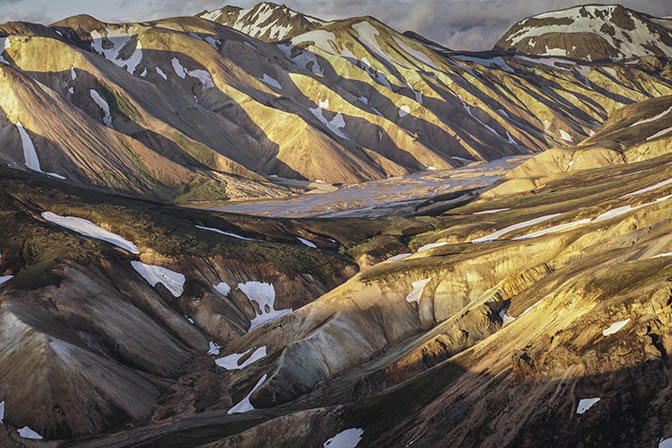 Colorful rhyolite mountains shine brightly in the sunset, view from Blahnukur mountain, Landmannalaugar 2017