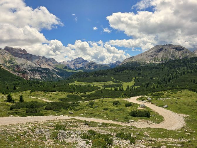 The trail traverses grassy basins dotted with bushes and dwarf mountain pine, 2025
